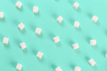 Geometry Pattern made of white sugar cubes on light blue background. Abstract, minimal style.