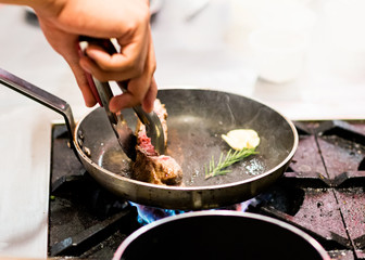 Chef cooking, Chef preparing food in the kitchen, closeup.