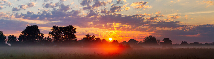 panorama of autumn sunrise and cool fog