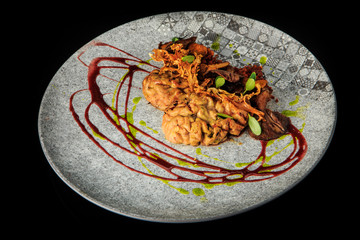 top view of lamb brain with mushrooms and meat