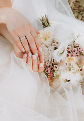 bride conceptual morning flowers white dress hands