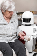 autonomous caregiver robot is holding a elastic bandage