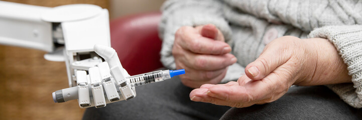 panorama with autonomous caregiver robot, holding a insulin syringe