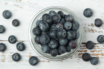 A glass bowl with blueberry