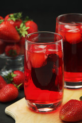 Glasses with strawberry drink with ice