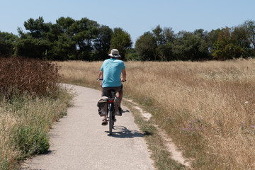 man ride bike during vacation on the island of Aix in Charente maritime France