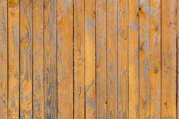 Close-up of a   brown wooden  wall  painted a very long time and the paint peeled off.  Brown texture background
