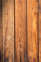 Fototapeta premium Brown wooden background from old yellow black planks, vertical format