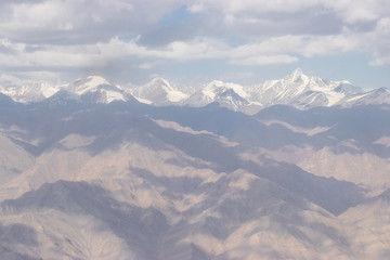 Fototapeta na wymiar View of the Himalayas mountain through airplane window.