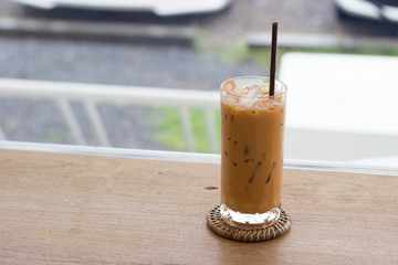 Thai tea with coffee shop background