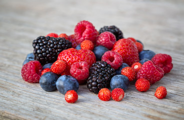 Ripe berries on a wooden board