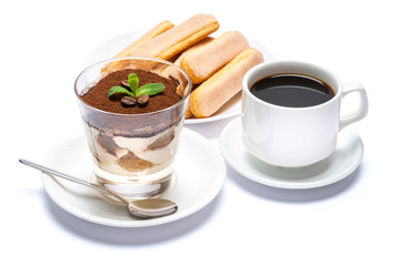 Classic tiramisu dessert in a glass cup, savoiardi cookies and espresso coffee on white background with clipping path