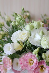 a bouquet of delicate white and pink eustomas