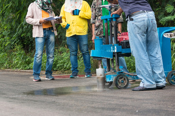 Engineering is drilling the road by Road drilling machine for Check road standards
