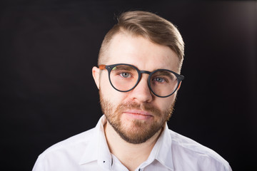 Portrait, guy and business people concept - Handsome man with glasses in white shirt looking at camera