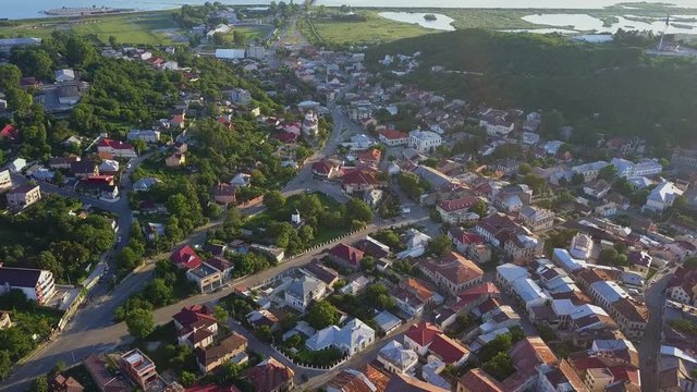 Aerial view of Slatina city and river Olt, Romania. Drone flight over the european city in summer day.