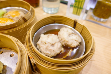 Dim Sum in Bamboo Steamer Basket.