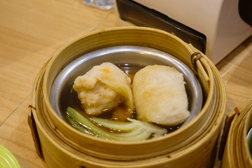 Pork with bamboo lining soup Dim Sum in Bamboo Steamer Basket.