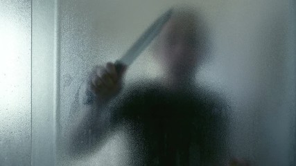 Killer with knife in the bathroom in 4K