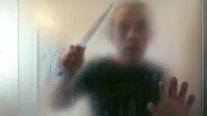 Killer with knife in the bathroom in 4K