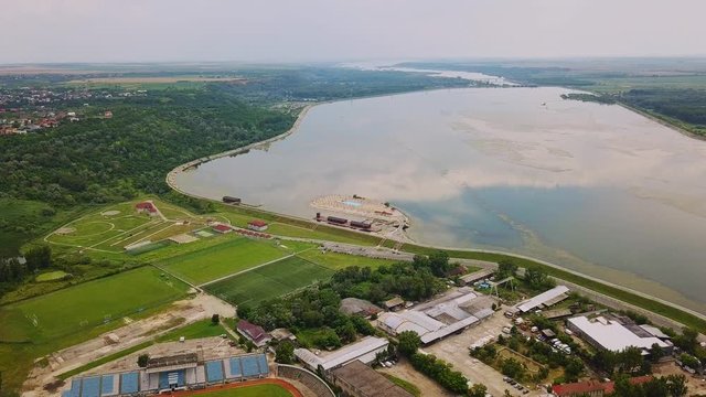 Aerial Drone Flight: View of the bridge over the river with cars. Olt river, Romania