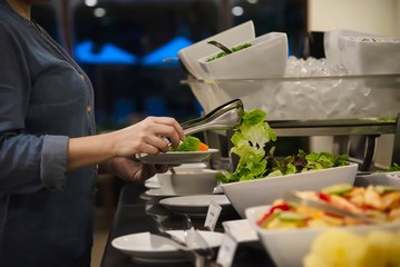 Woman eat the breakfast set in a hotel - people with breakfast in hotel concept