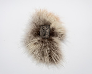 Norse rune Algiz, isolated on fur and white background. Protection, help of the Gods.