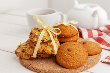 Homemade crunchy cookies and  tea on a wooden table