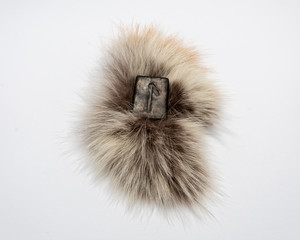 Norse rune Laguz (Laukr), isolated on fur and white background. Love, youth, intuition, mysticism, magic. Water, flow, life.