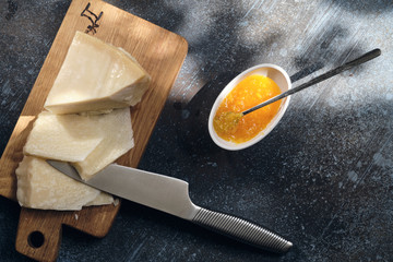 Parmigiano Cheese on  wooden cut board