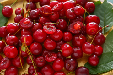 Many ripe sweet cherry on tray, closeup