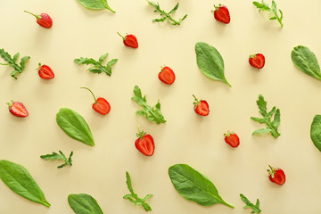 Fresh strawberry with herbs on color background