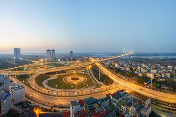 Aerial skyline view of Hanoi city, Vietnam. Hanoi cityscape by sunset period at roundabout to Nhat Tan bridge, Ho Tay district