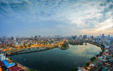 Fototapeta na wymiar Aerial skyline view of Hanoi city, Vietnam. Hanoi cityscape by sunset period at Hoang Cau lake, Dong Da district