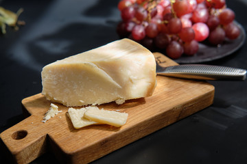 Parmigiano Cheese on  wooden cut board