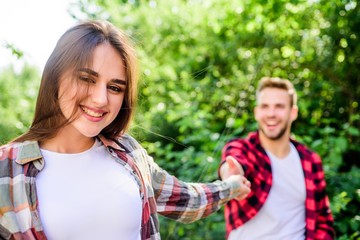 Obraz premium Follow me.Couple outdoors nature defocused. Starting relationship. Couple relationship. Couple in love meeting. Put yourself forward in way that is respectful to women while still being outgoing