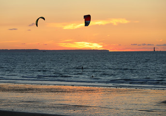  Sunset and Kitesurfers on the beach in Saint Malo,  Brittany, France