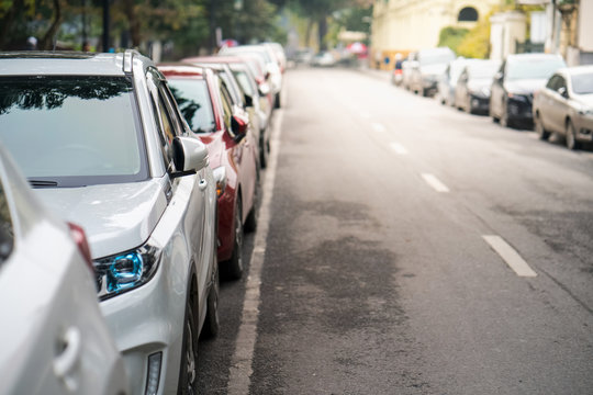Cars parked on the urban street side