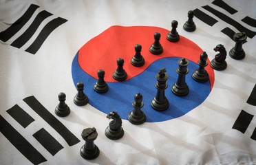 Black chess pieces on Korea flag.