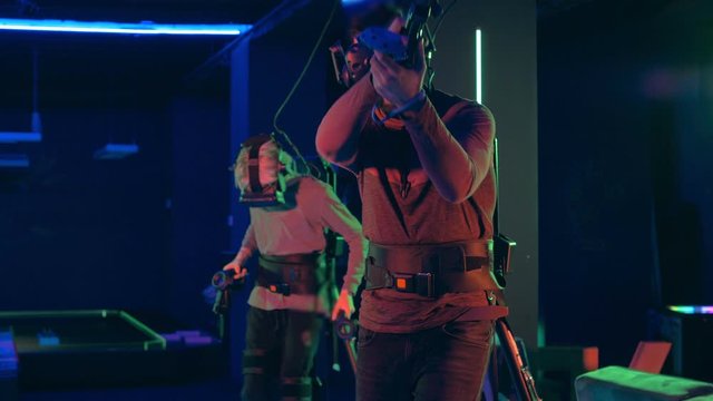 Gamers playing VR games at virtual reality game room