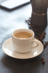 Obraz na płótnie Canvas Hot cup of espresso coffee on a table