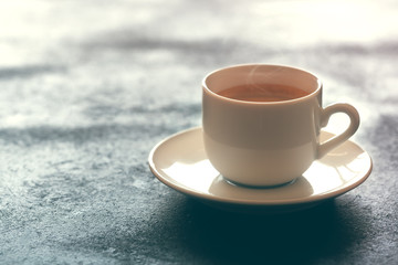 Hot cup of espresso coffee on a table