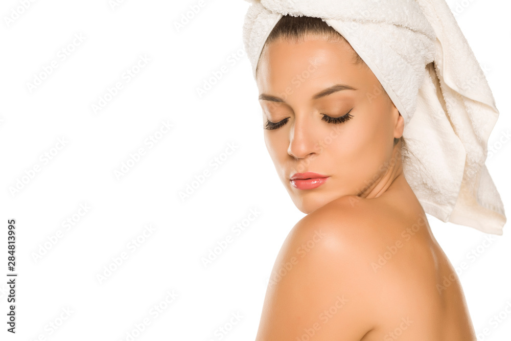 Canvas Prints Young beautiful woman with towel on her head on white background