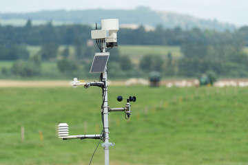 A small weather station on a farm.