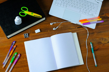 Child is doing in school lessons table. Desk of the student. Boy is doing his homework.
