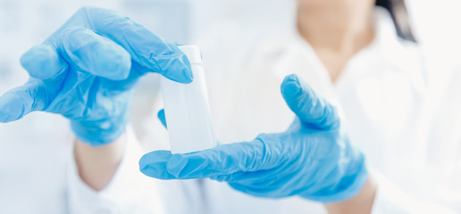 Chemist holds water samples for research on contamination radioactivity, biological copy space