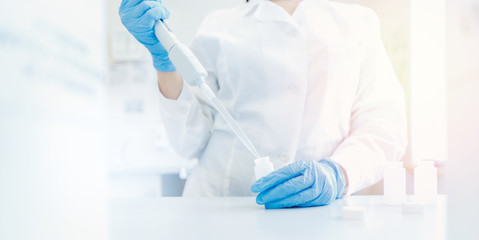 Water analysis for radiation and pollution. Hands of researcher in white coat