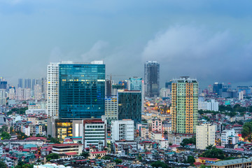 Fototapeta na wymiar Aerial skyline view of Hanoi city, Vietnam. Hanoi cityscape by sunset period at Ba Dinh district viewing from Lang Ha street