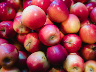 Bunch of fresh red apples for sale in the market close up top view