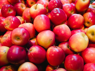 Bunch of fresh red apples for sale in the market close up top view